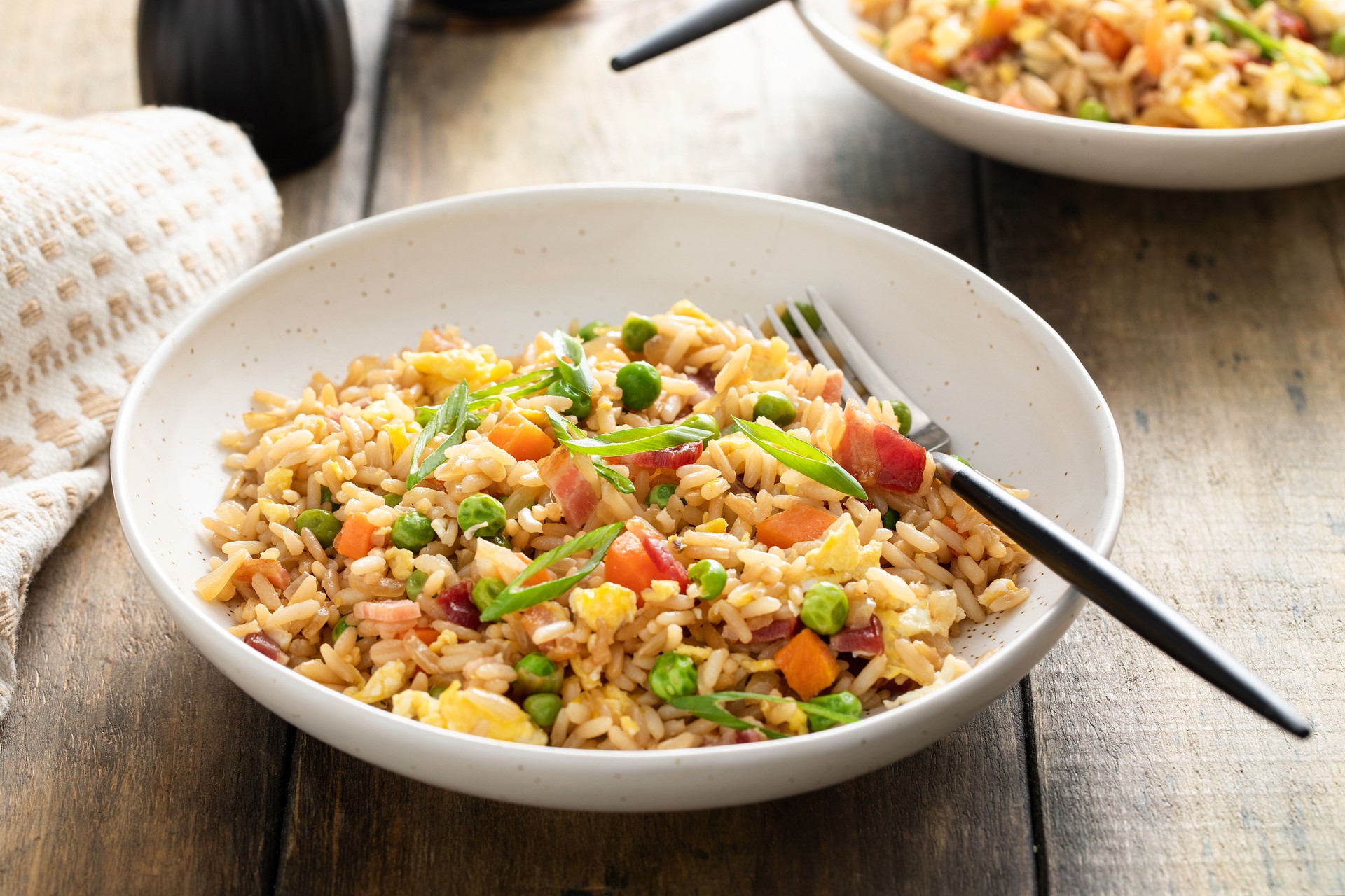 Breakfast fried rice with bacon and scrambled eggs