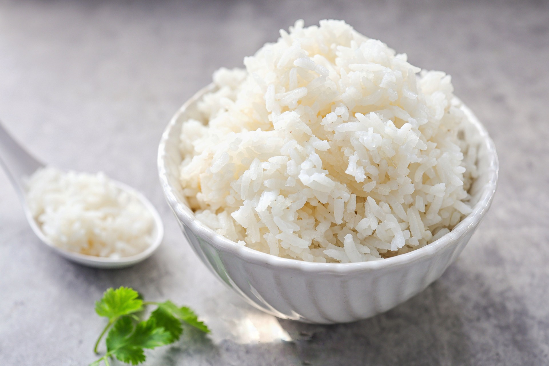 Cooked white rice or steamed rice in a white bowl