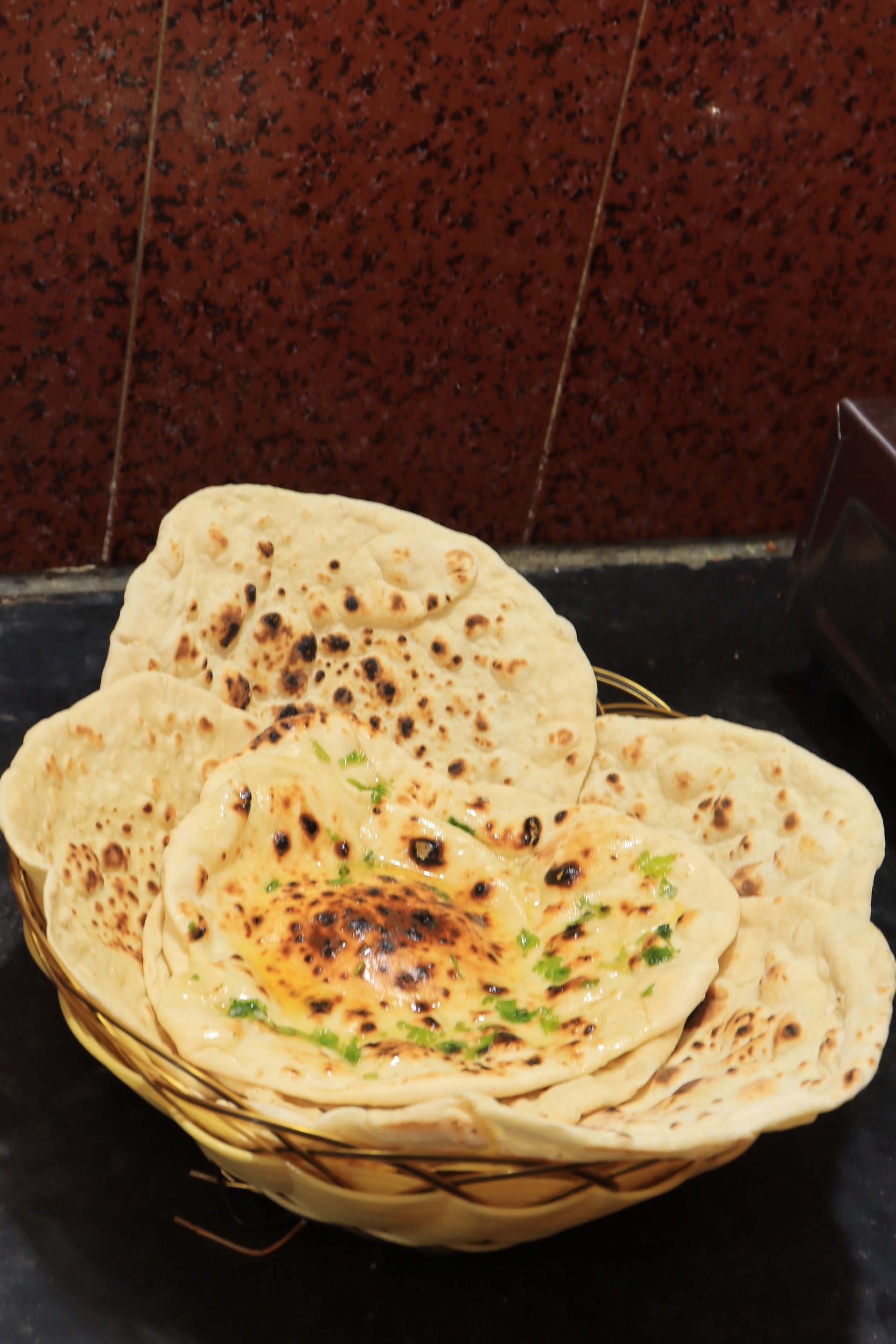 Homemade Butter Naan isolated on black background