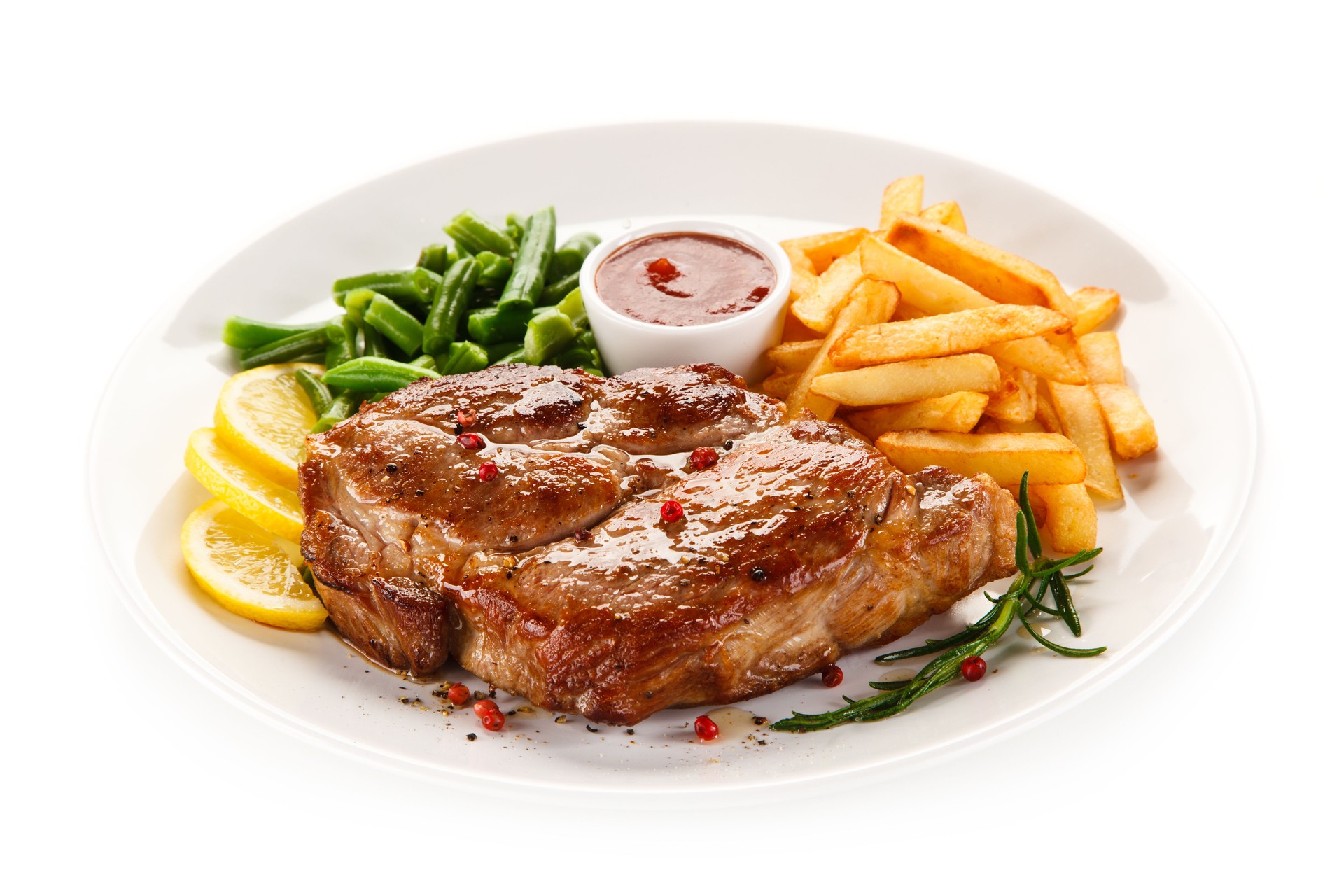 Grilled steak with French fries and vegetables